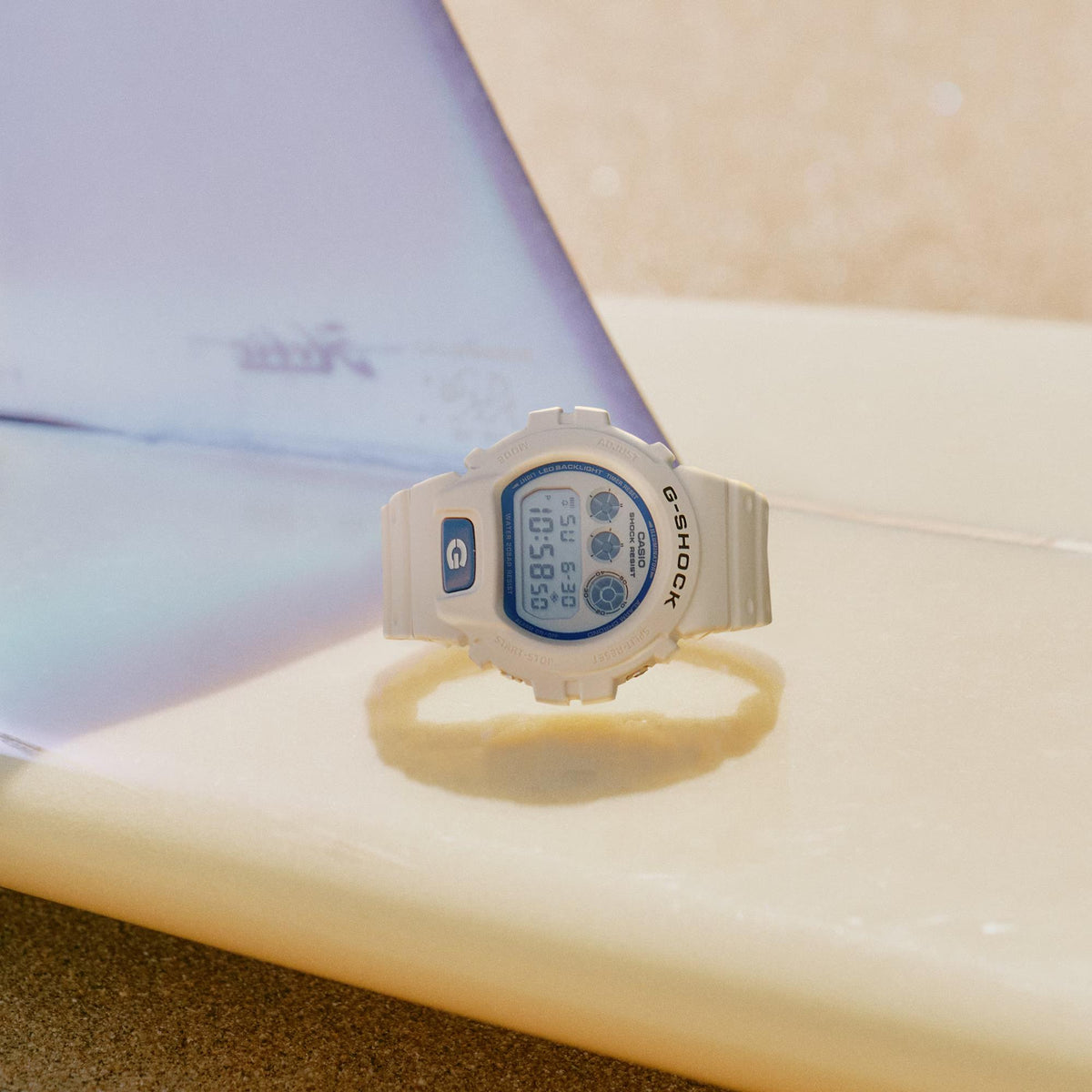 Casio G-Shock DW-6900HDS-7ER beach surf culture theme lifestyle view on a surfboard