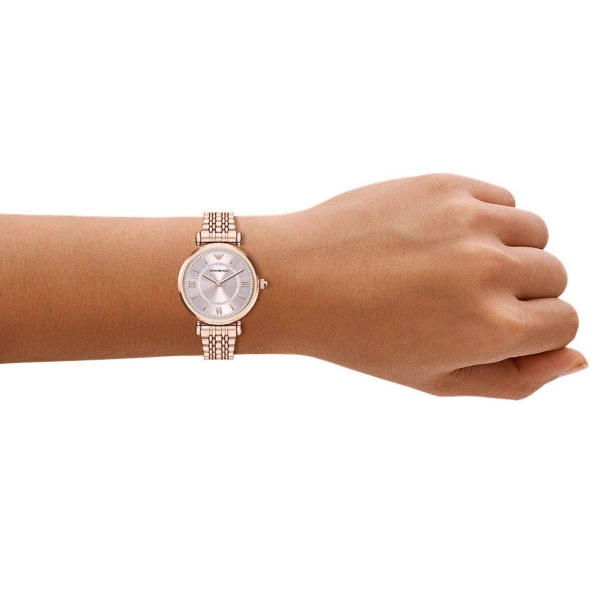 On-wrist perspective of the Emporio Armani Gianni AR11767 timepiece displaying the light pink dial and rose gold-tone steel bracelet on a wrist