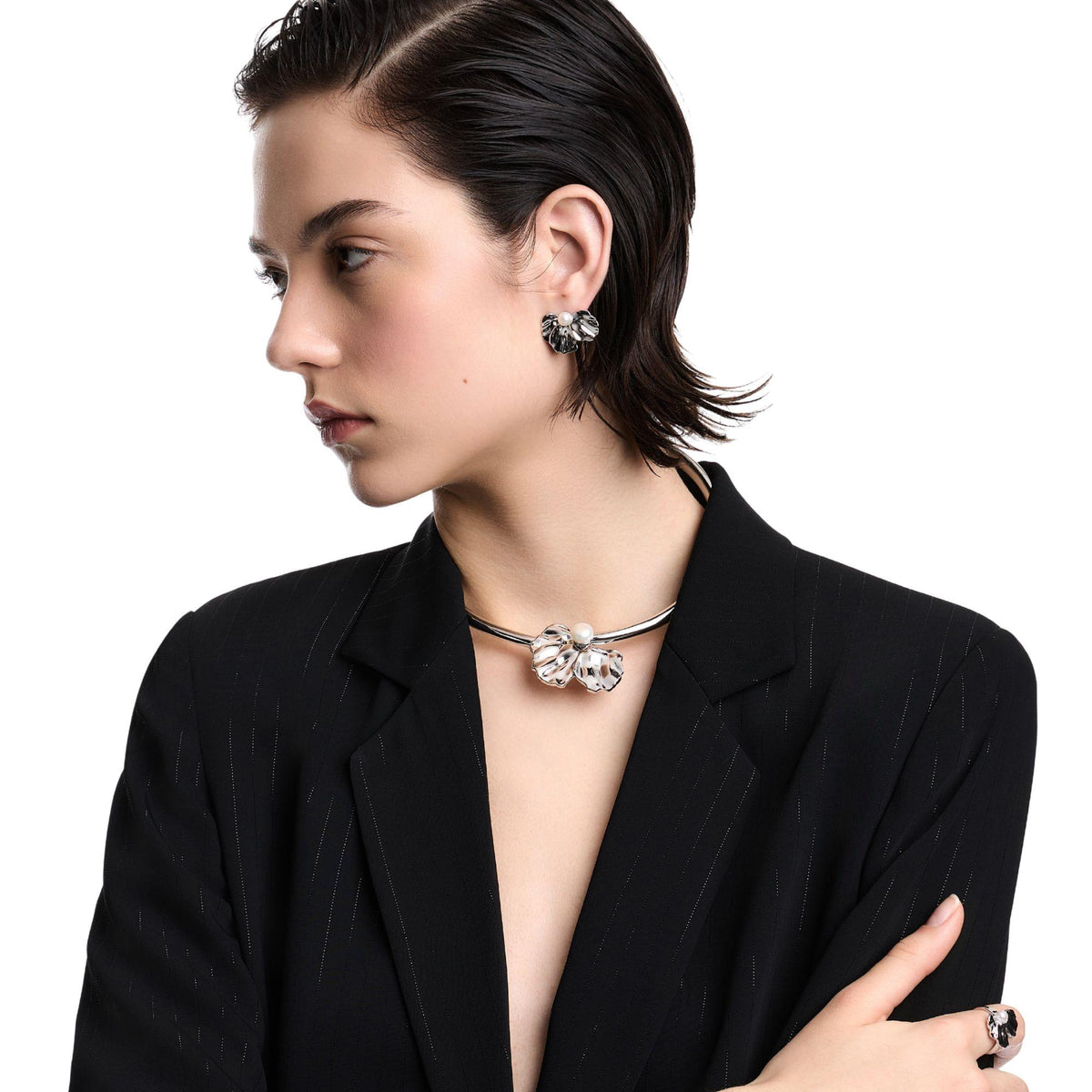 White petal flower pearl statement earrings with round pearl centers, silver-tone stud style