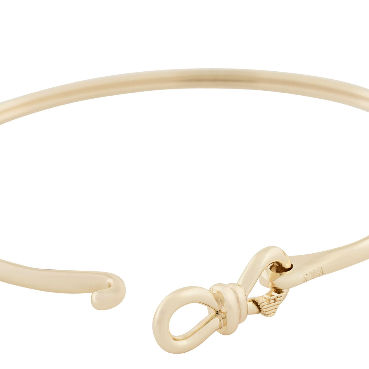 Close-up gold-tone ribbon bracelet with toggle bow clasp