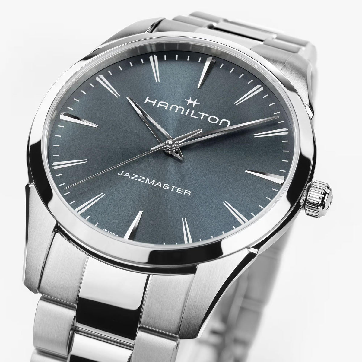 Hamilton Jazzmaster H32461141 battery-powered watch dial macro close-up showcasing silver baton indices, polished hands, and blue sunburst finish