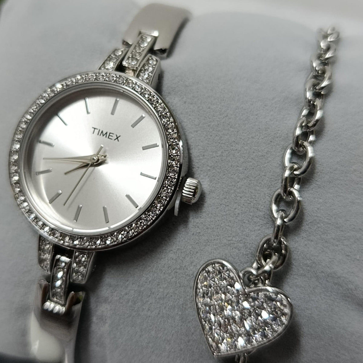 Timex Trend silver dial watch TWG067700 with rhinestone bezel and segmented bracelet, plus heart charm