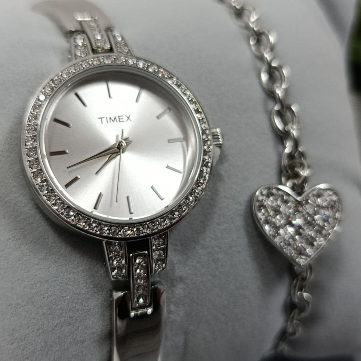 Timex Trend silver ladies quartz wristwatch TWG067700 with sparkling bezel, white dial, and heart pendant bracelet