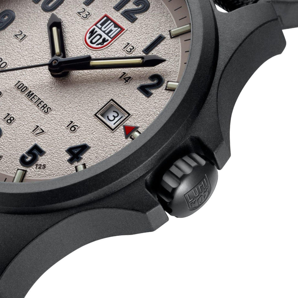 Close-up of watch crown and case with grey dial numerals and date window