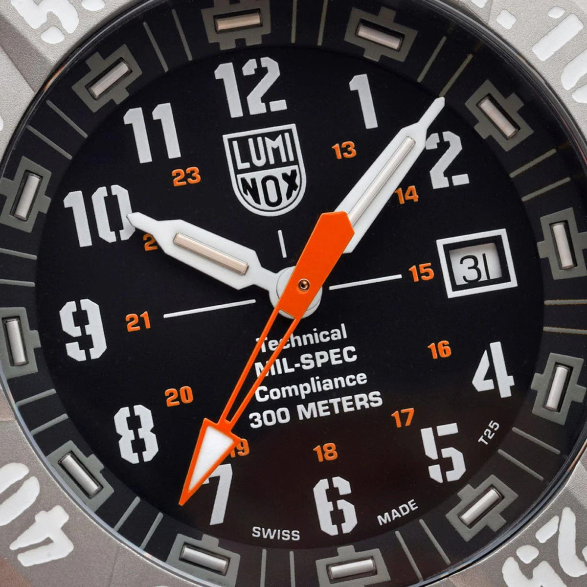 Close-up of Luminox MIL-SPEC 46mm black dial with orange hands and numbered markers