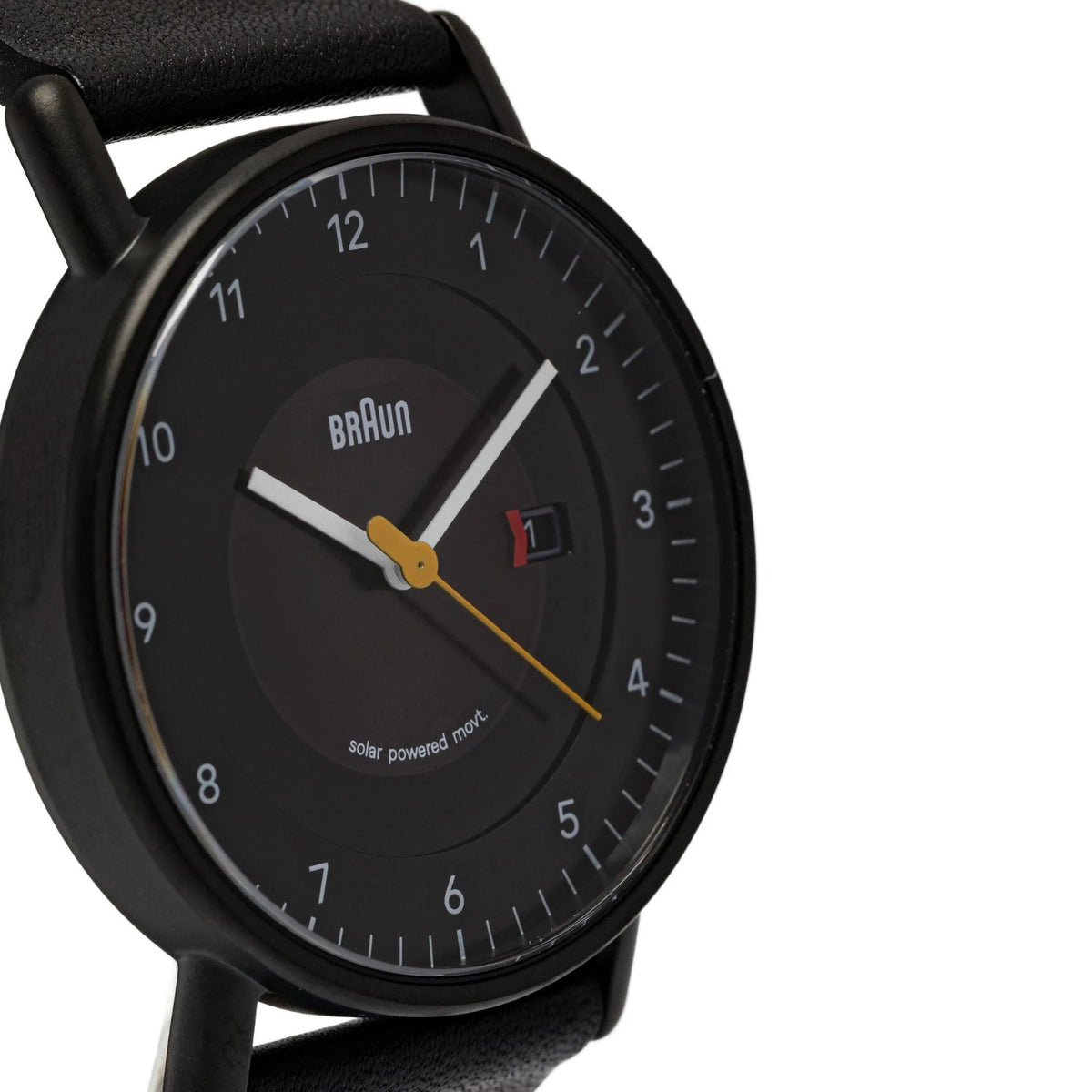 Men's solar powered watch angled view, black dial with yellow hands and date window