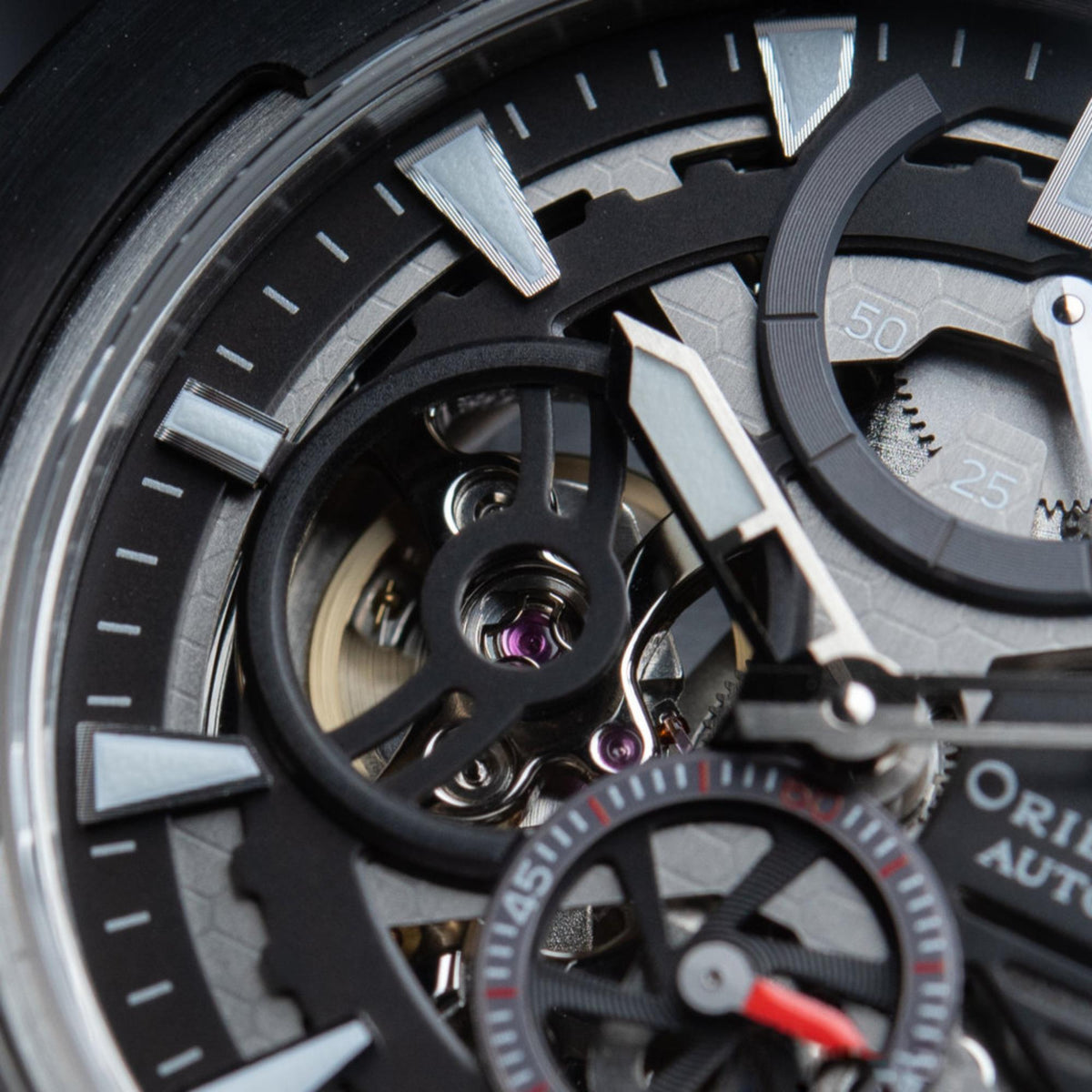 Men's automatic skeleton watch macro view, black dial and exposed gearwork.