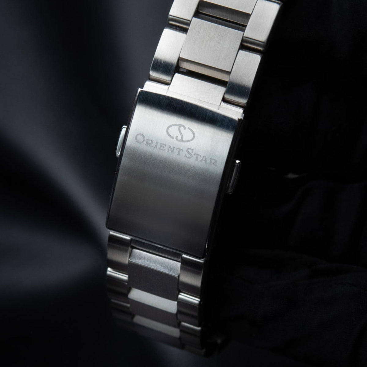 Orient Star automatic skeleton watch caseback with steel bracelet, fold clasp