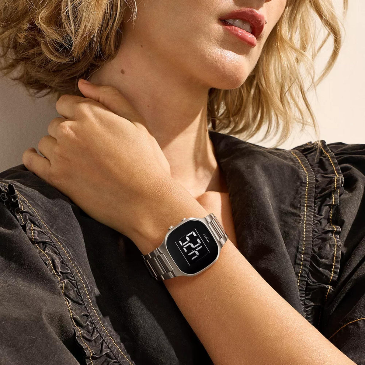 Skagen digital steel watch on wrist with black time display and link bracelet