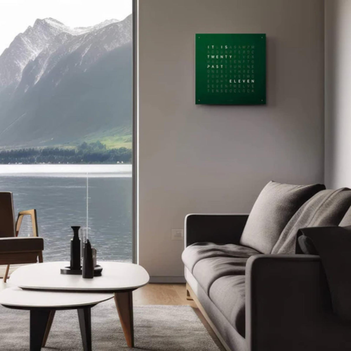 Green velvet wall clock mounted on wall with English word display