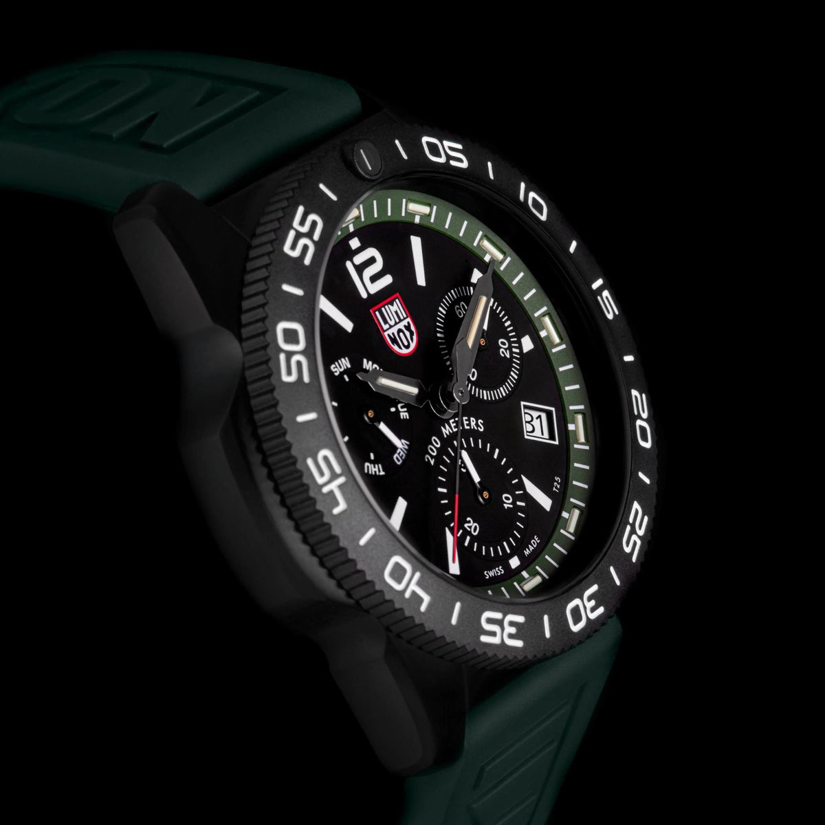 Men's diver chronograph watch angled view, black dial, green rubber strap, luminous bezel