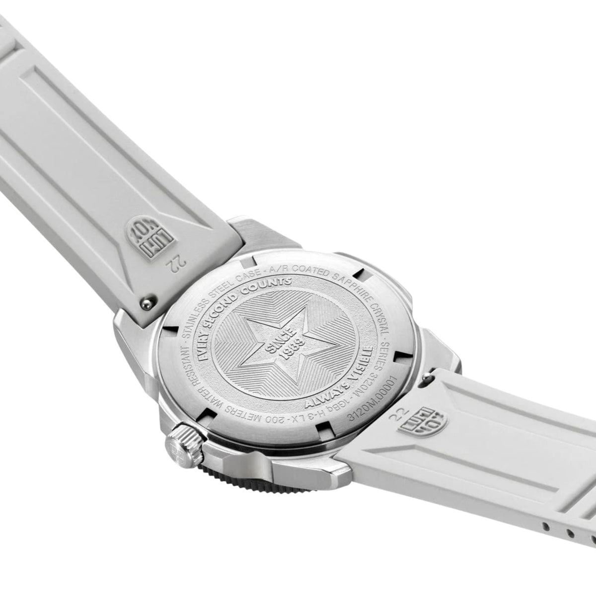 Diver watch caseback with engraved design on a light rubber strap