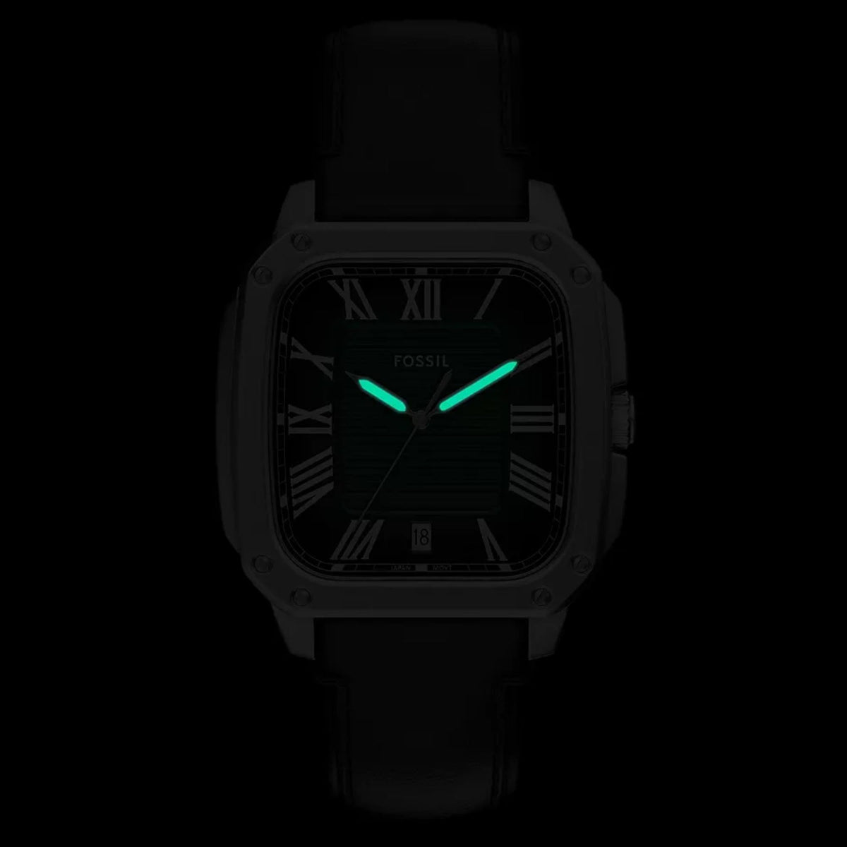 Luminous dial view of the Fossil Crosby FS6150 timepiece displaying glowing green hands in dark conditions