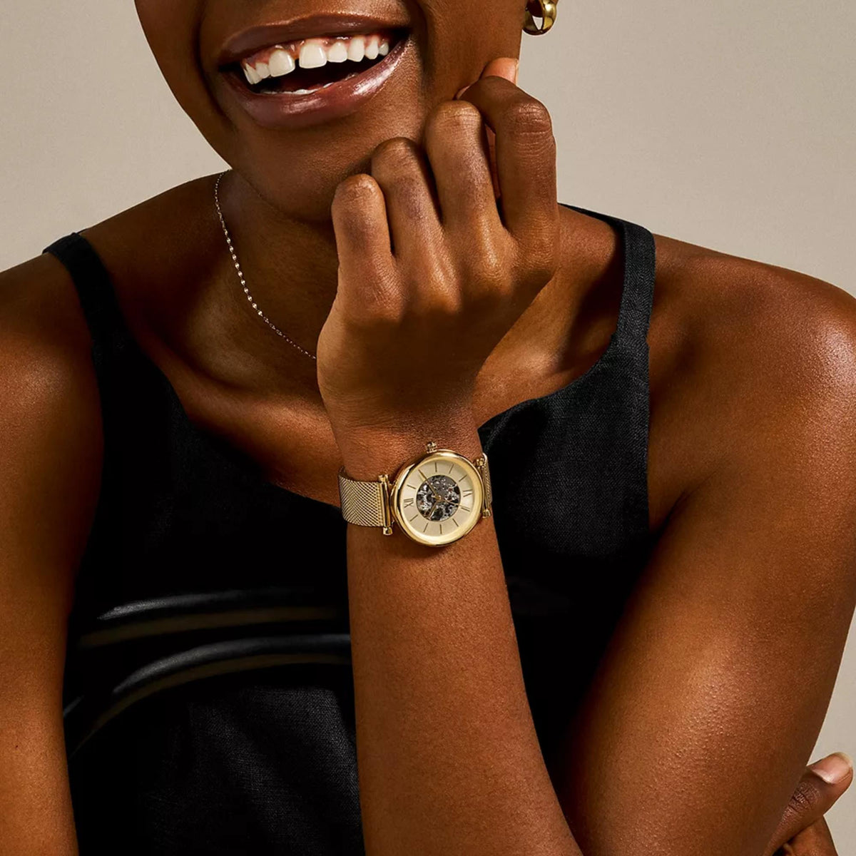 Fossil Carlie 35mm Skeleton Gold Dial Steel Ladies Automatic Watch ME3250 on a woman's wrist lifestyle view