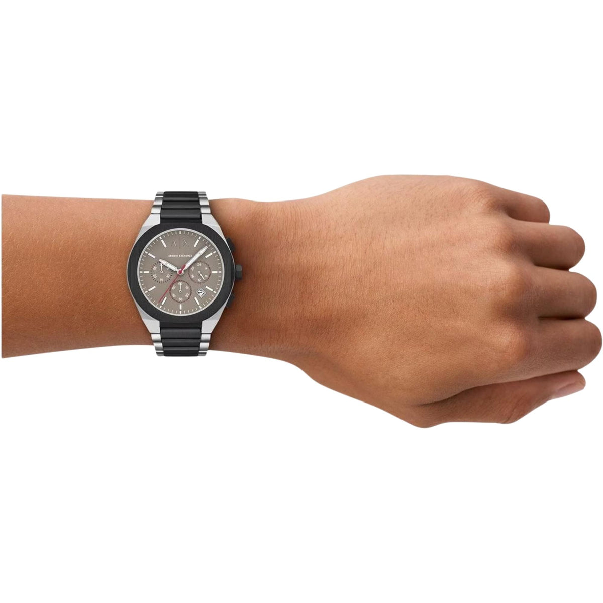 Men's steel chronograph watch on wrist with brown dial and black link bracelet