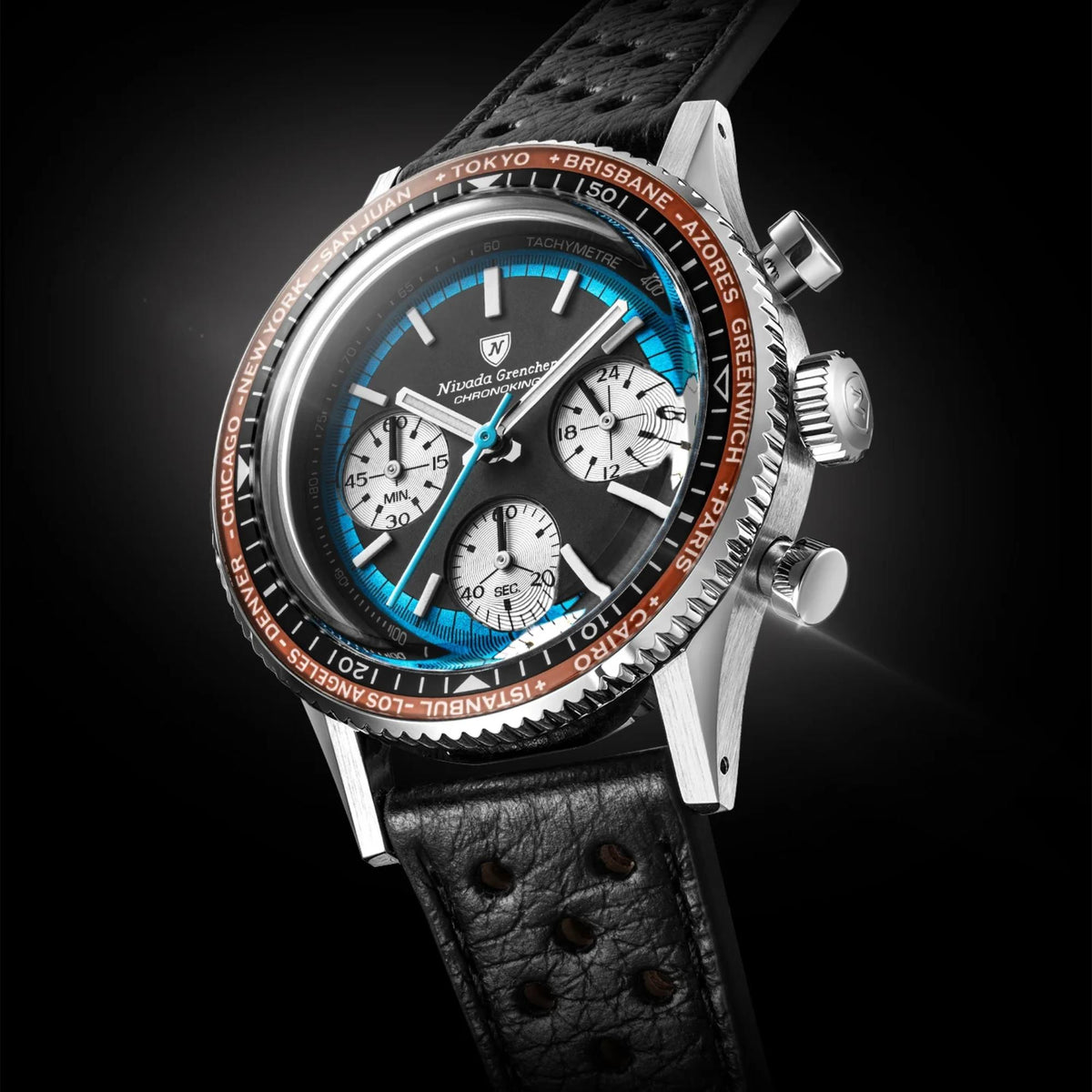 Nivada Grenchen Chronoking 38mm Chronograph with a black dial, bright blue subdials and hands, and a rotating black bezel with orange city names around the edge