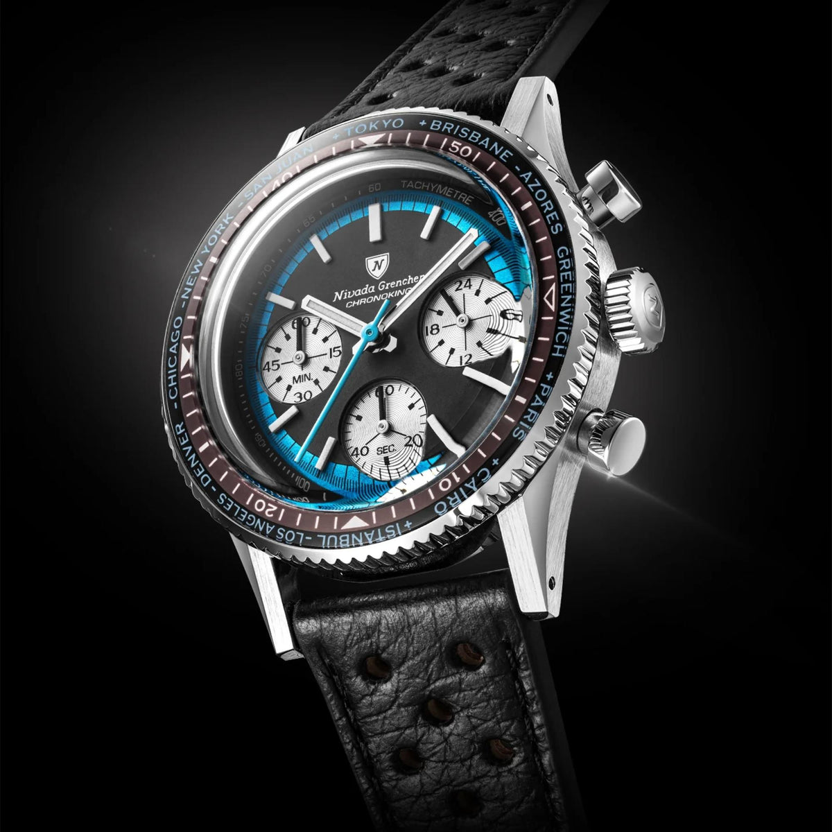 Nivada Grenchen Chronoking 38mm Chronograph wristwatch with a silver-toned case, black dial, vibrant blue subdials and hands, and a black leather strap, shown against a dark background