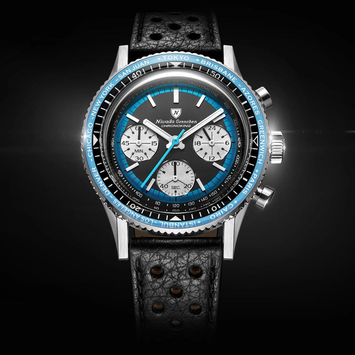 Nivada Grenchen Chronoking chronograph watch with a black leather strap, a silver-toned case, a black dial with a vibrant blue subdial and blue bezel, and white hands and markers, set against a dark background