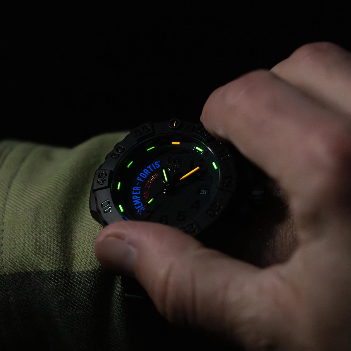Luminox Navy SEAL XS.3515.N close-up wrist shot displaying glowing tritium tubes on black dial