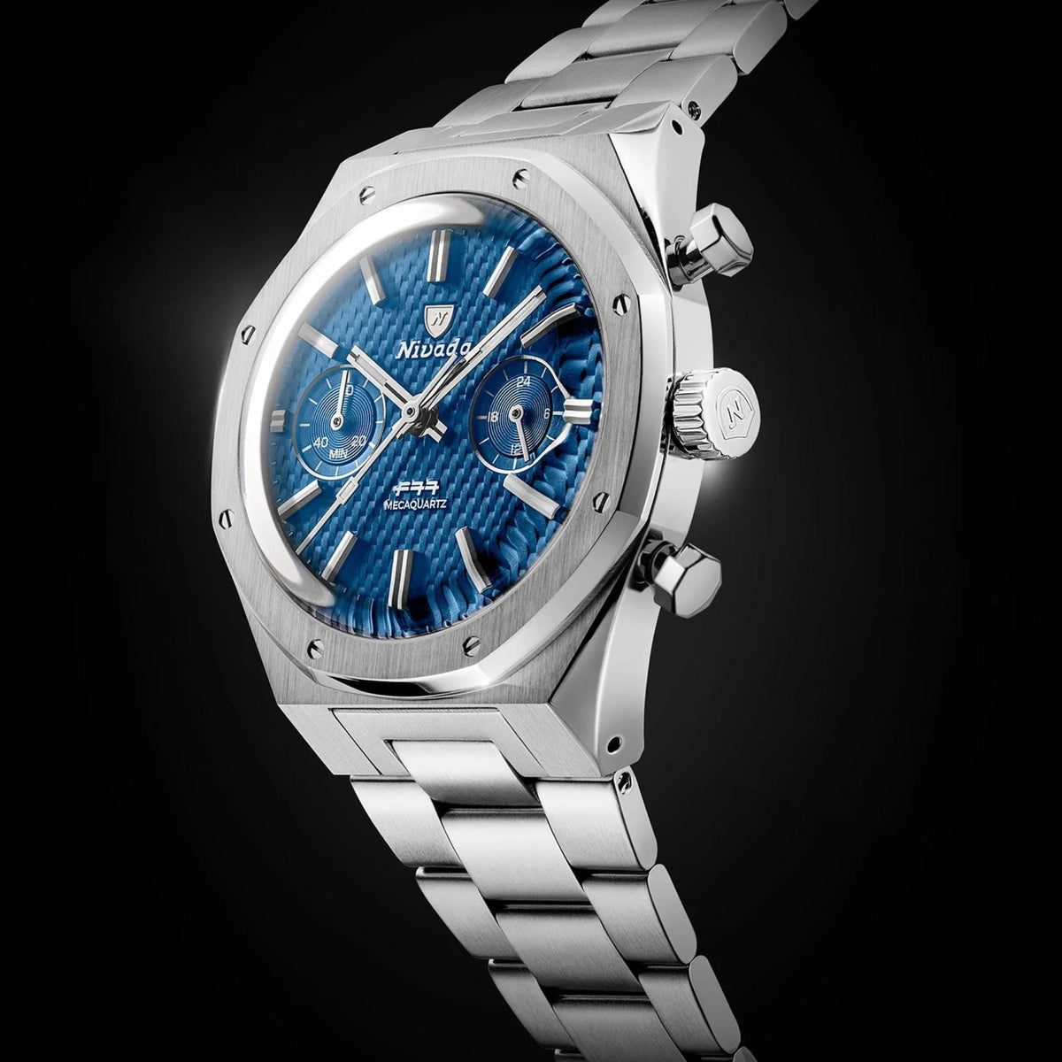 Nivada Grenchen men's steel chronograph wristwatch, side profile with crown and blue dial