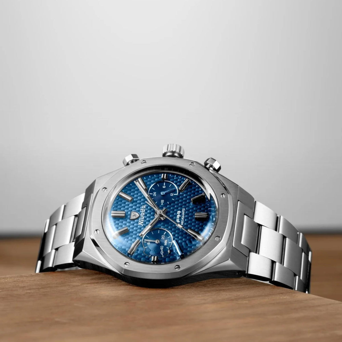 Nivada Grenchen men's steel chronograph wristwatch with blue dial and linked bracelet band