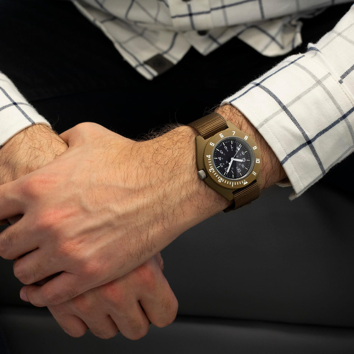 Marathon Navigator mens watch WW194001DT-0802 on wrist showing its black dial, hour markers, and hands