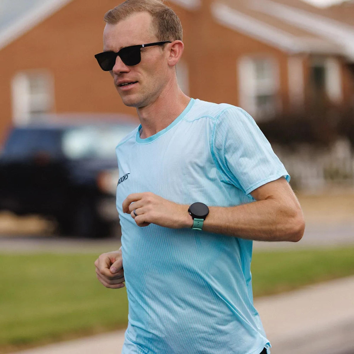 Suunto Run 2 SS051641000 lifestyle action shot worn by a runner outdoors
