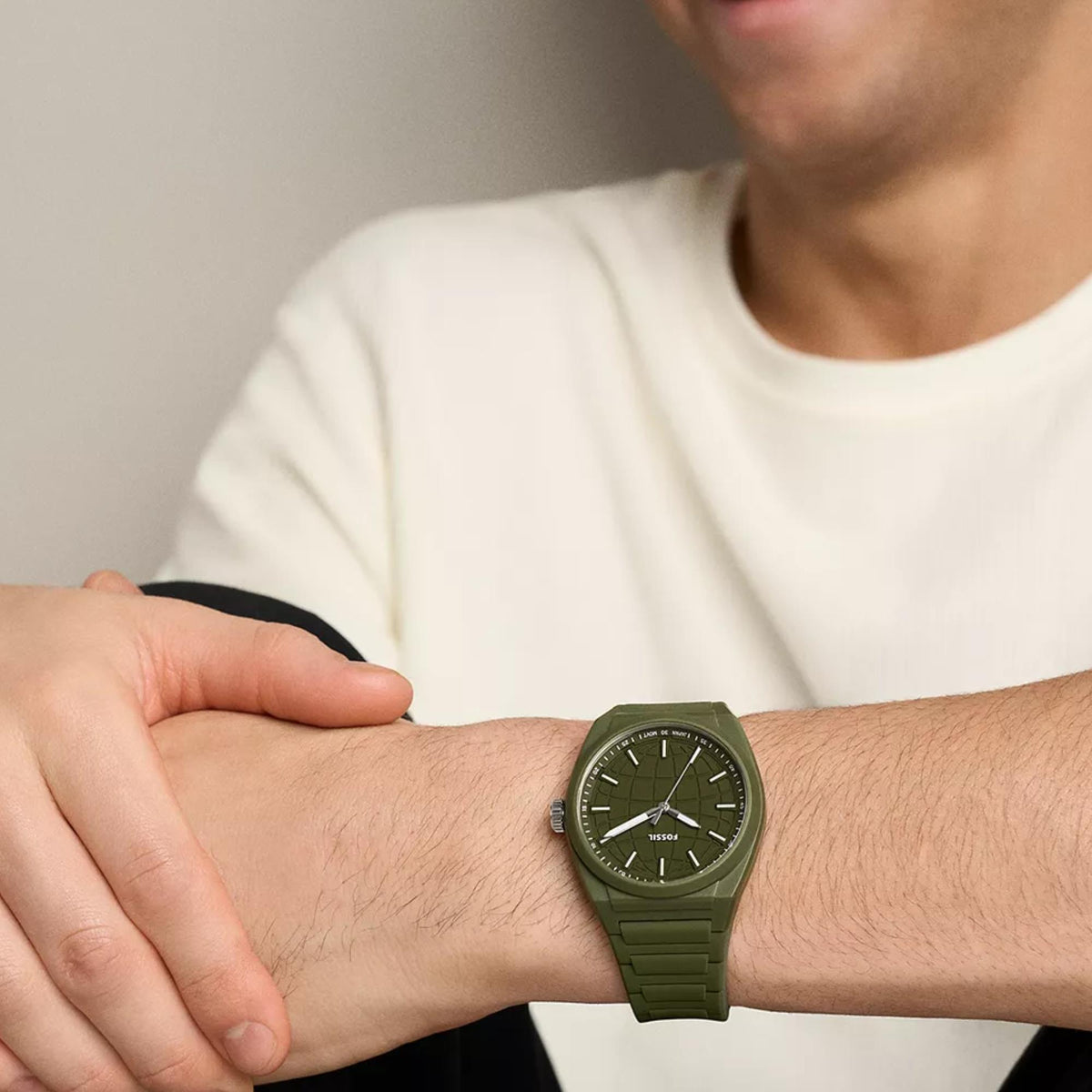 Fossil Everett FS6178 mens quartz timepiece on wrist showcasing green dial and green silicone band