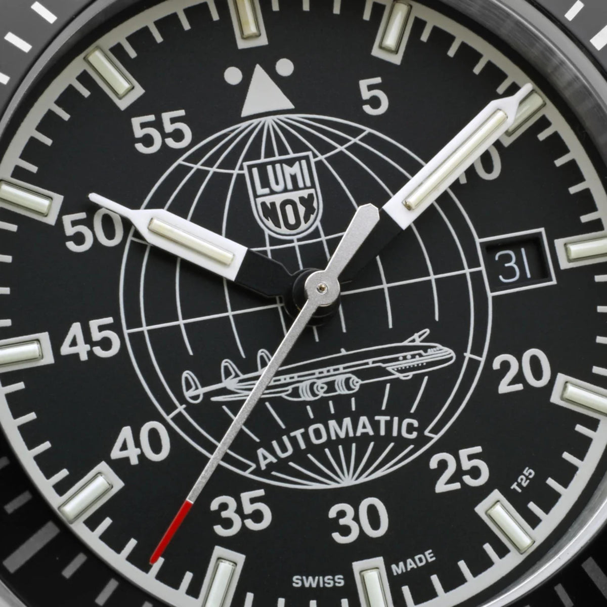Luminox Constellation 9600 Series XA.9601 extreme close up of black dial with globe motif, white hands, and date window