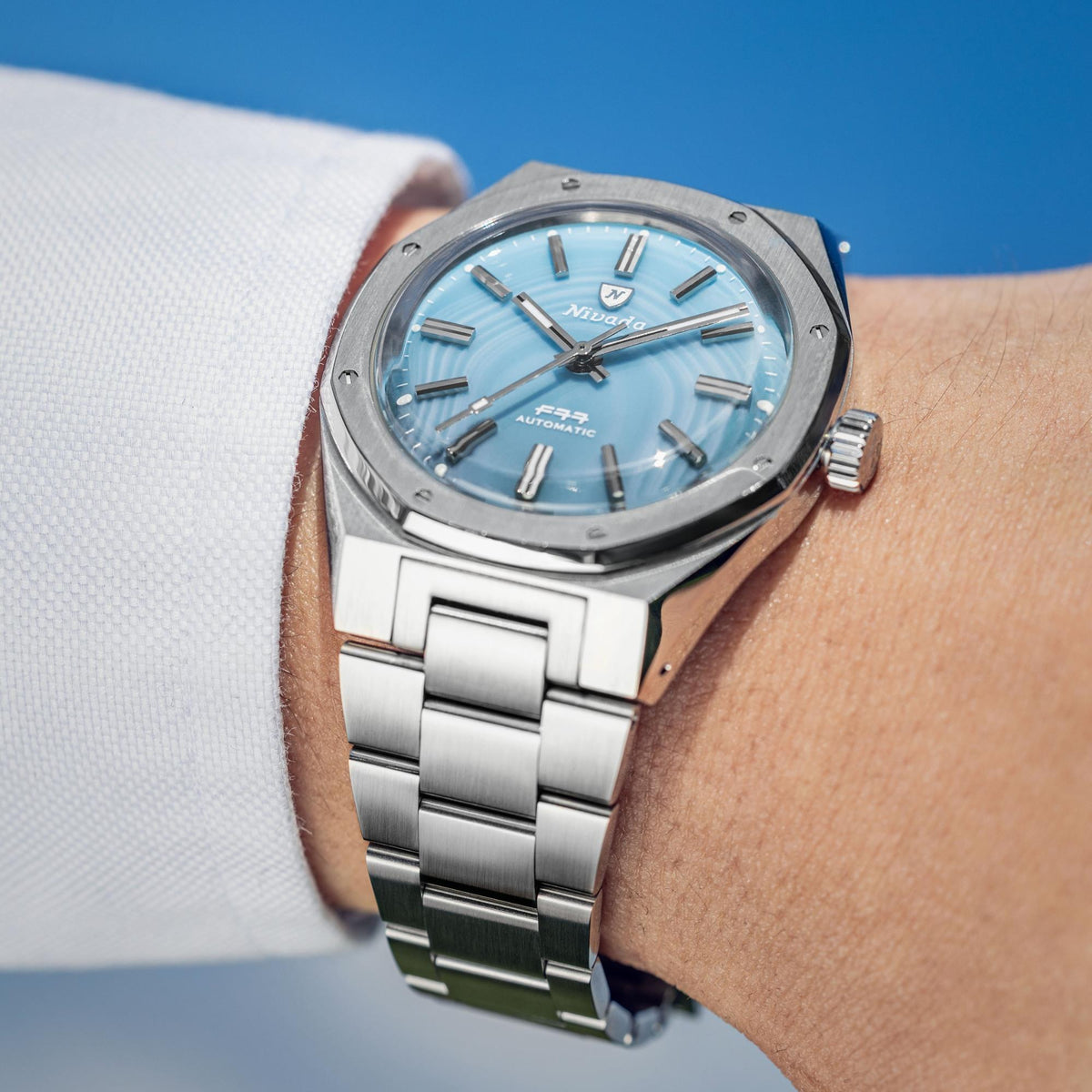 Nivada Grenchen F77 MK2 68061A77 wrist shot displaying ice agate dial watch with steel bracelet on wrist