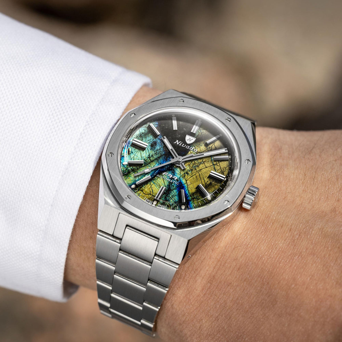 Nivada Grenchen F77 68054A77 wrist shot showing labradorite dial with stainless steel case profile