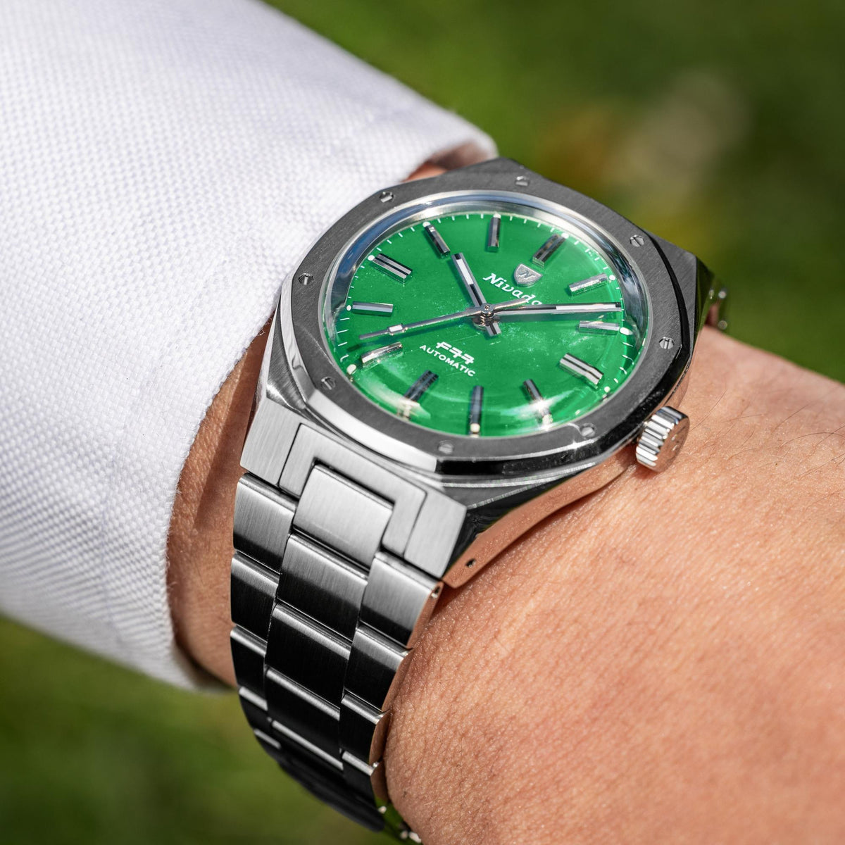 Nivada Grenchen F77 68055A77 on wrist shot showing jade dial with steel bezel profile