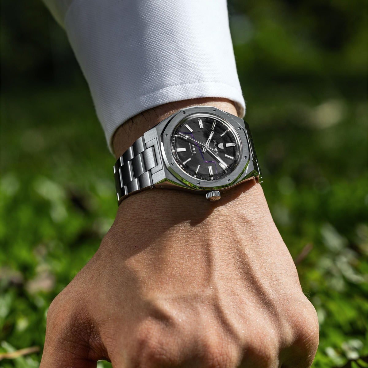 Nivada Grenchen F77 68058A77 wrist view showcasing mens steel automatic watch with shungite black dial