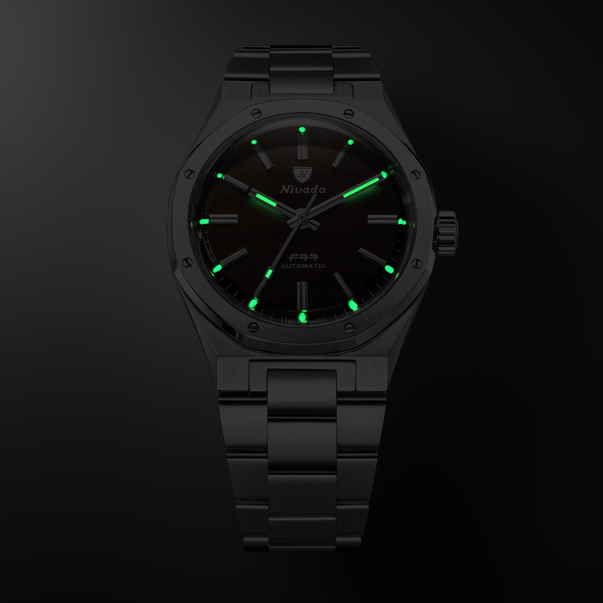 Nivada Grenchen F77 MK2 100 Years Edition 68060A77 dark view displaying luminous hands and hour markers in dark environment