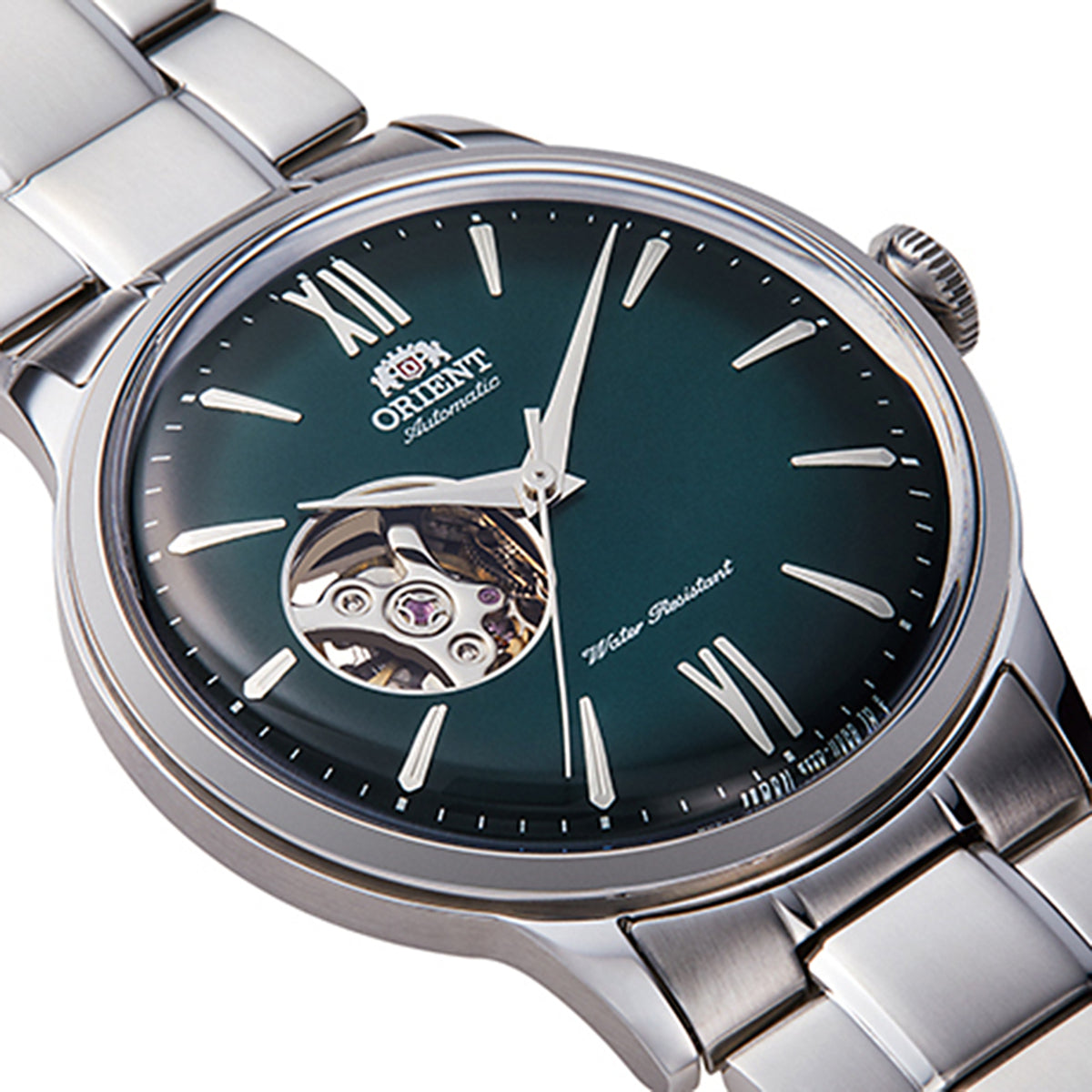 Men's steel automatic watch close-up with green dial, Roman numerals and visible open-heart movement