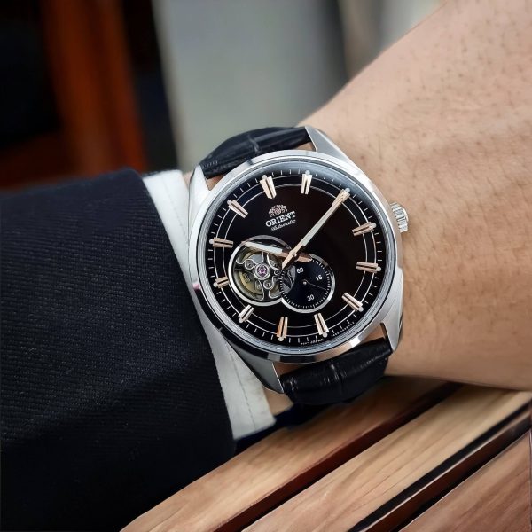 Men's automatic skeleton dial watch on black leather strap, visible inner mechanism