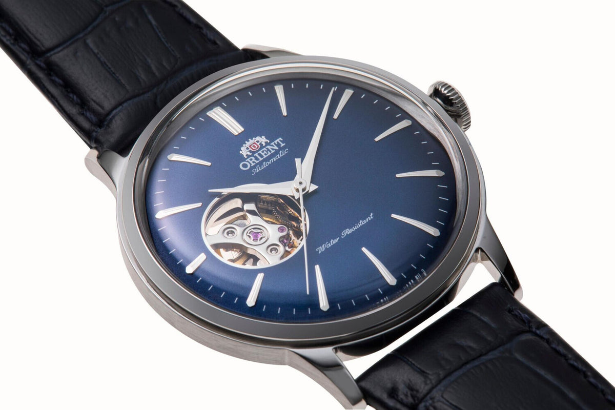 Orient Bambino open-heart watch with blue dial, silver case, and dark leather strap