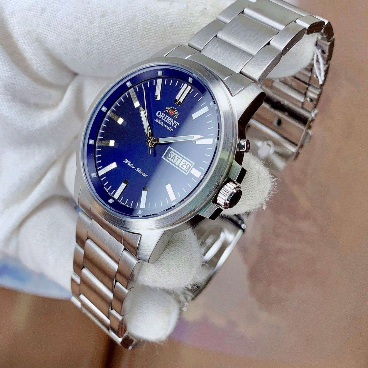 Orient Contemporary RA-AA0C02L39B wristwatch with a blue dial on a white surface