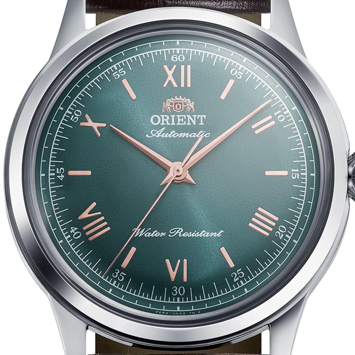 Orient Bambino RA-BB0001E30B macro shot focusing on sunburst green dial texture, hands, and Roman numerals