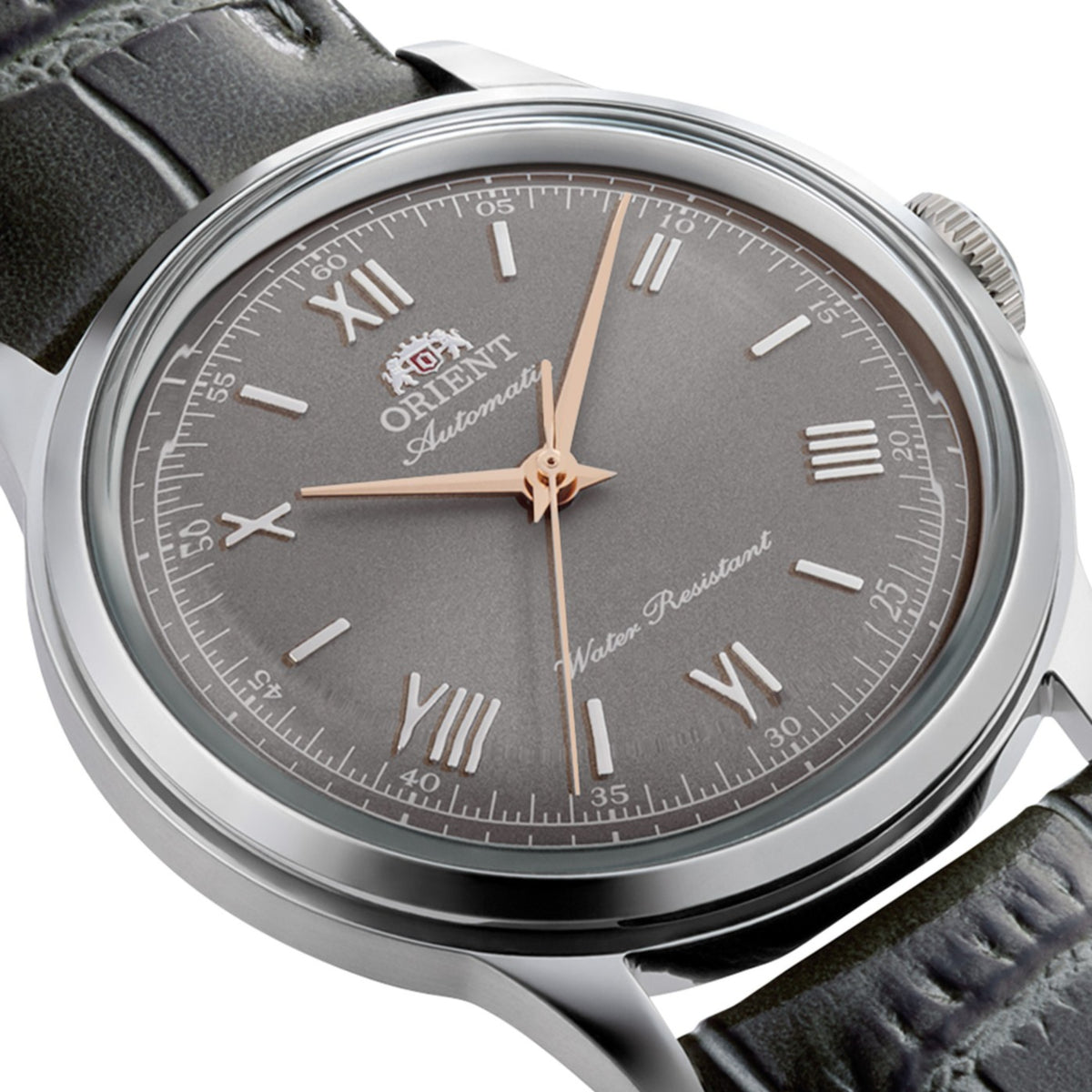 Orient Bambino RA-BB0006N30B side perspective showing grey dial, steel case, crown, and leather strap attachment