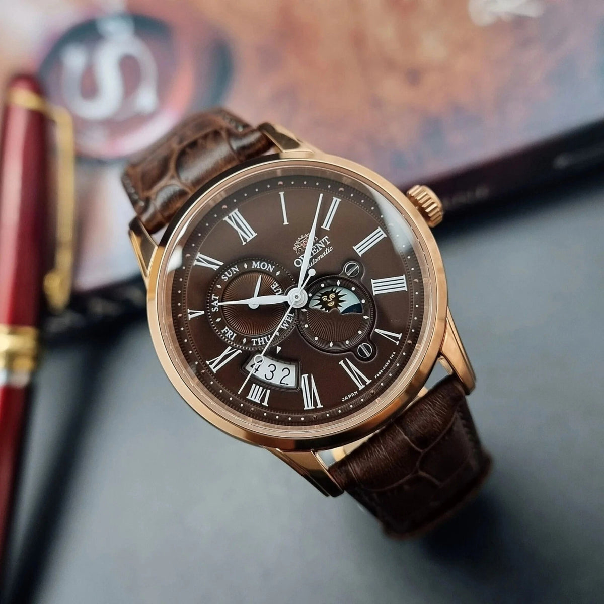 Orient Bambino Sun and Moon brown dial automatic watch with three sub-dials and brown leather strap