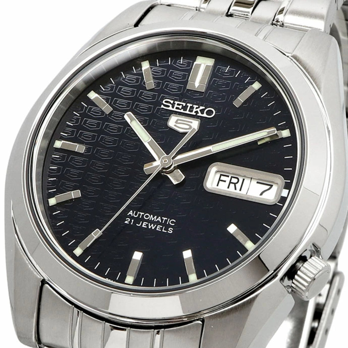 Close-up of Seiko 5 automatic watch SNK357K1 dial with dark pattern, SEIKO 5 mark, and date window