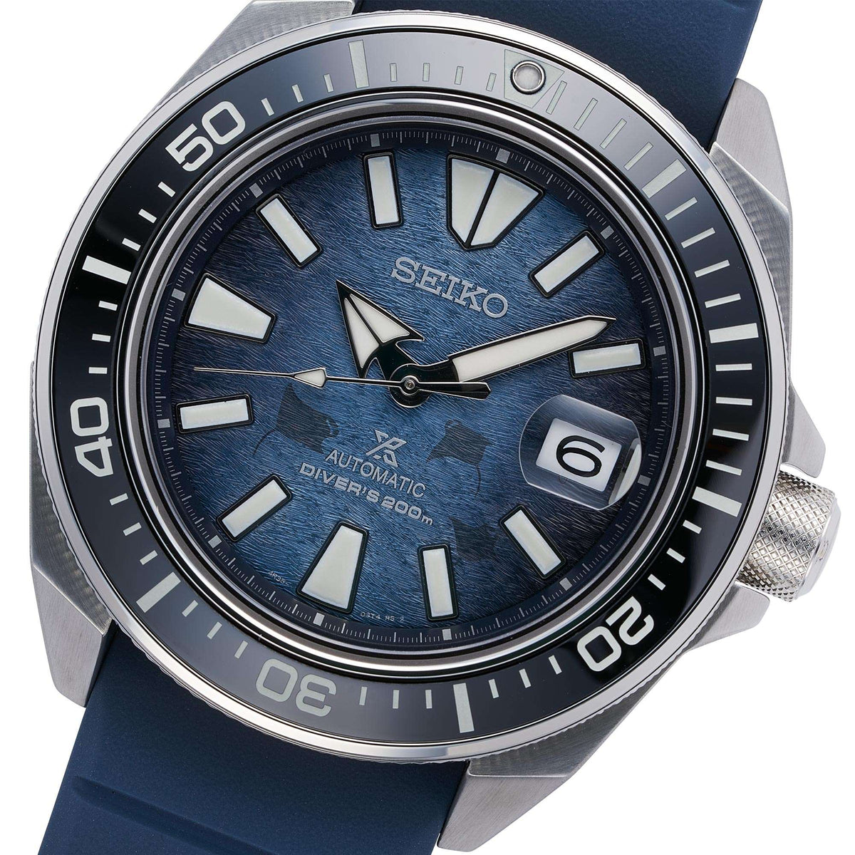 Men's Seiko automatic diver watch with textured blue dial, date window, and blue silicone strap