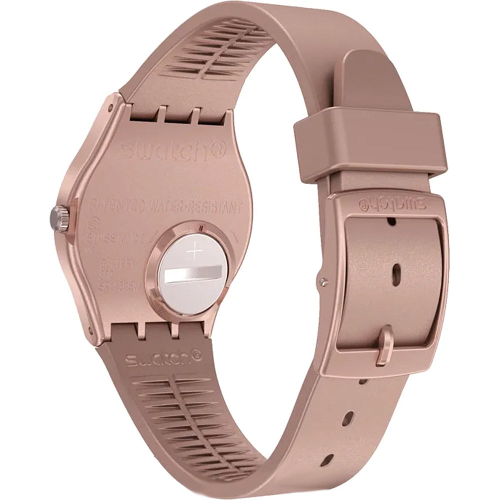 Rose quartz watch with textured bezel and clasp, showing silicone strap underside