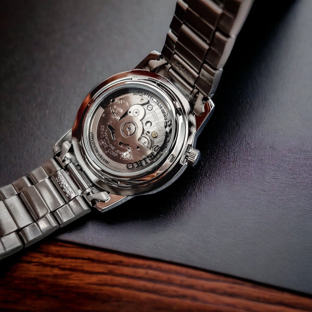 Seiko 5 Automatic SNKE49K1 back view displaying exhibition case back with automatic movement