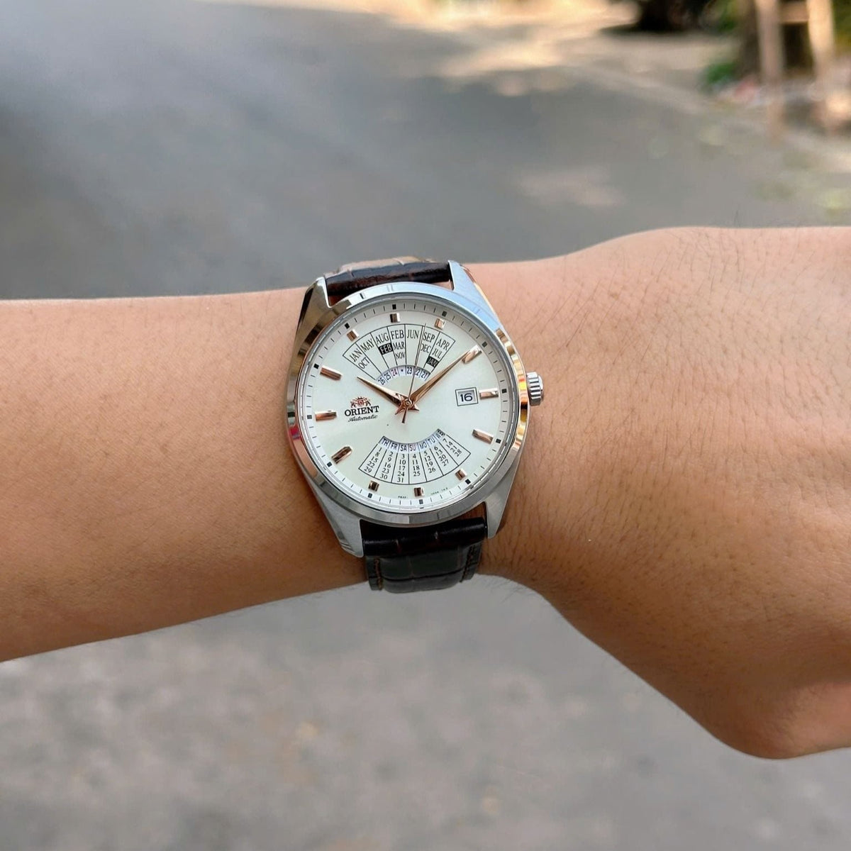 Orient Multi-Year Calendar RA-BA0005S30B white dial timepiece on wrist outdoors