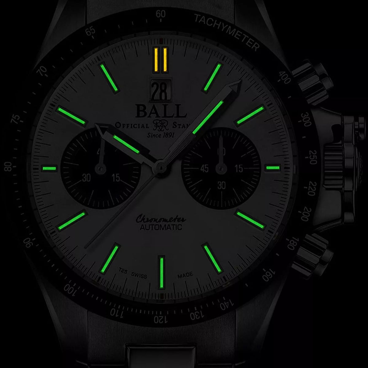 Chronograph automatic watch dial with glowing green hands and markers on dark background