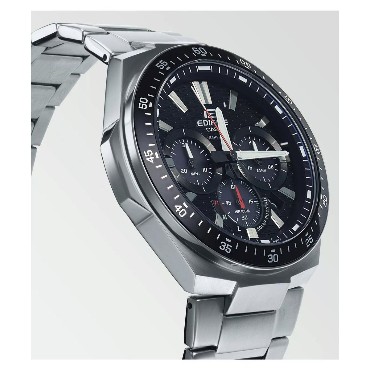 Close-up of men’s stainless steel solar chronograph watch with black dial and blue bezel