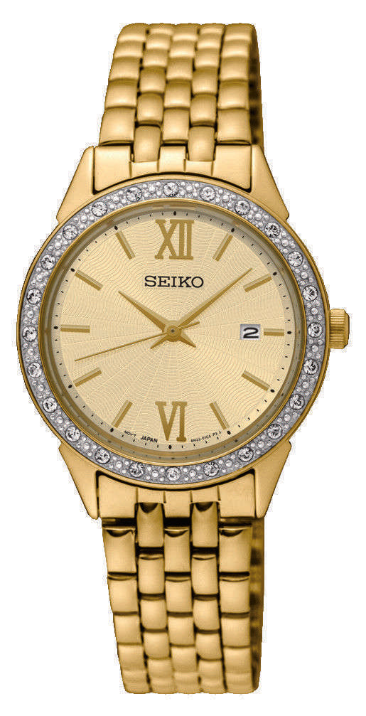Gold ladies dress watch with diamond bezel, cream dial, Roman numerals, metal link band