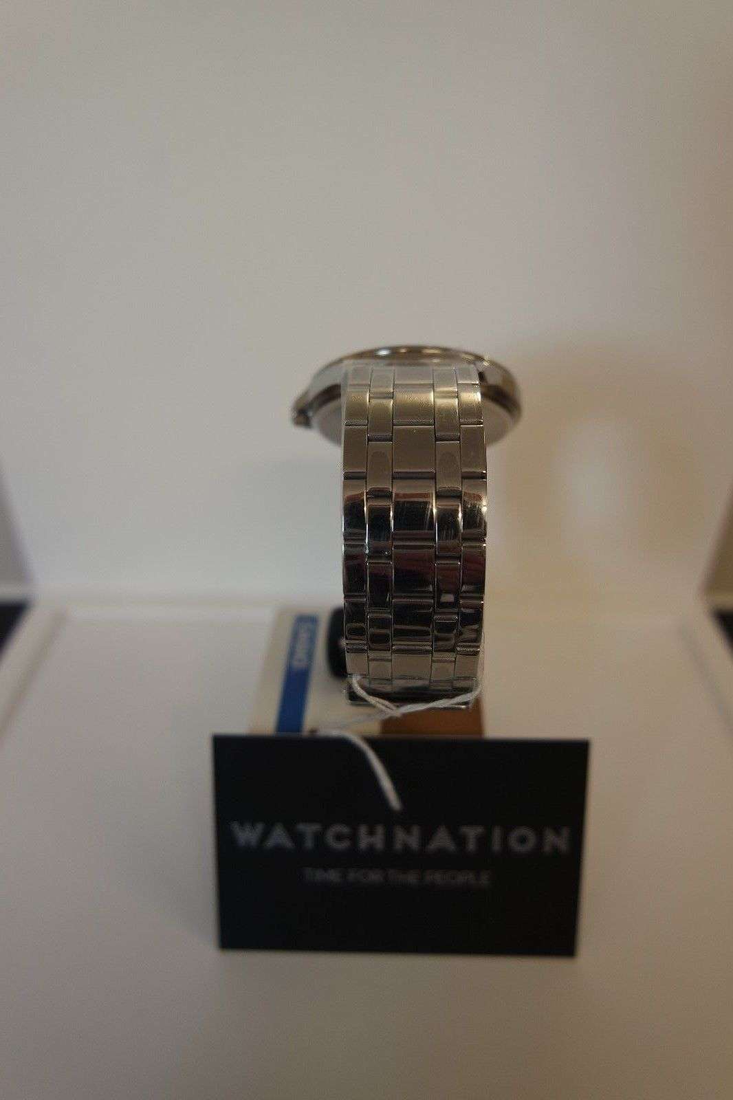 Silver metal link bracelet watch with round case top view